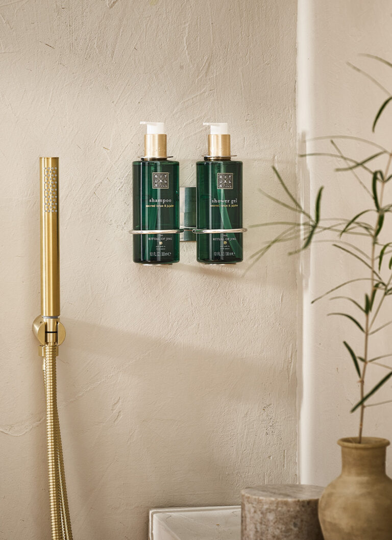 ritual green bottles on holders on bare wall